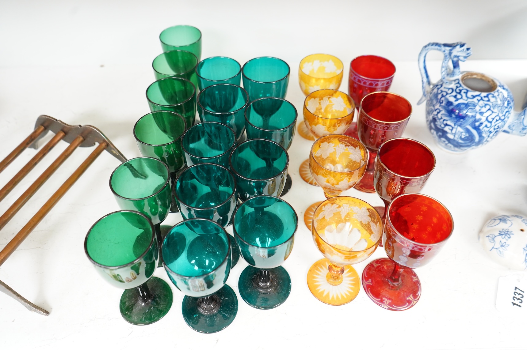 A collection of 19th century and later colour wine glasses to include amber flashed cut glasses, largest 12cm high
